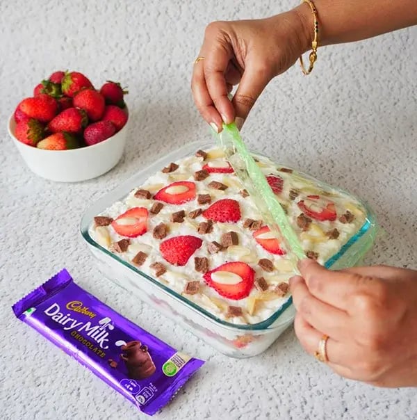Strawberry Icebox Cake with Almonds and Dairy Milk - Cut into pieces and serve