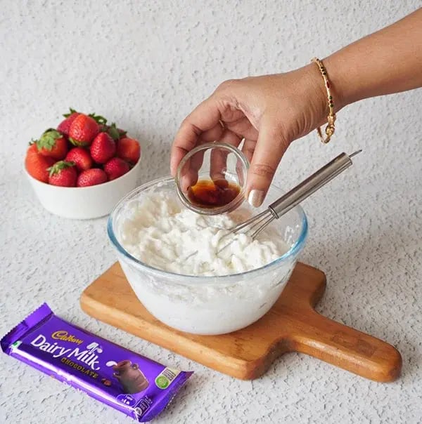 Strawberry Icebox Cake with Almonds and Dairy Milk - Stir in vanilla essence