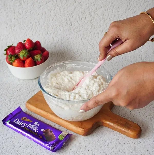 Strawberry Icebox Cake with Almonds and Dairy Milk - Fold in together
