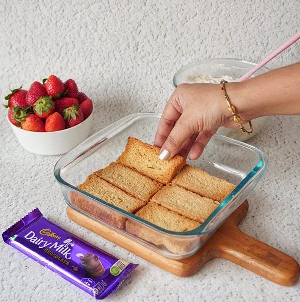 Strawberry Icebox Cake with Almonds and Dairy Milk - Lay down a single layer of crackers