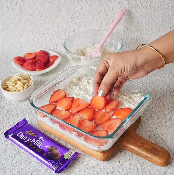 Strawberry Icebox Cake with Almonds and Dairy Milk - Add a layer of sliced strawberries