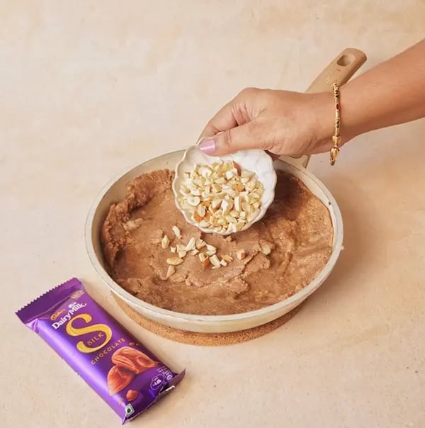 Suji Ka Halwa with Cadbury Dairy Milk Silk-Garnish with chopped nuts