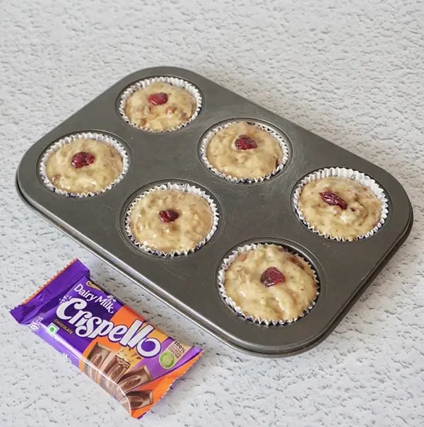 Sweet Potato Muffins with Cranberries and Crispello Chunks - Pour the batter evenly