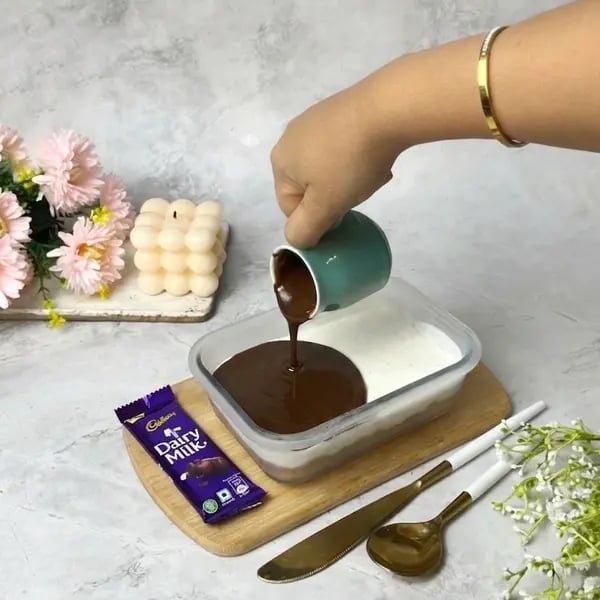 The Ultimate Vanilla Cinnamon Dairymilk Cheesecake - Pouring Melted Chocolate