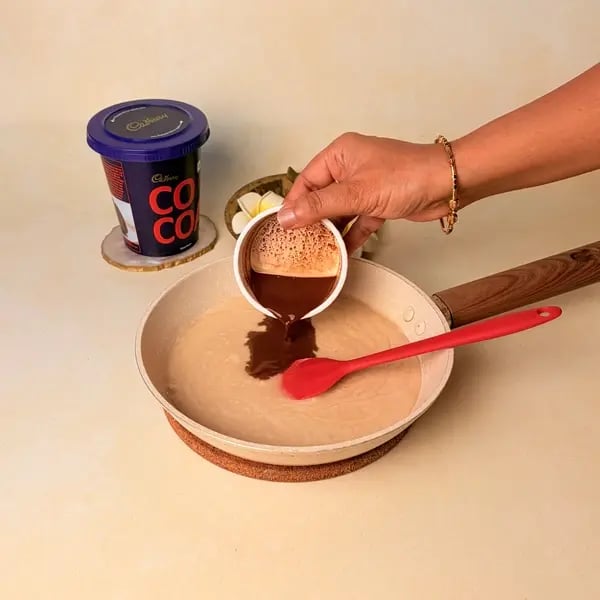 Tirunelveli Halwa Recipe For Onam: A Traditional South Indian Sweet - Stirring Cocoa Mixture