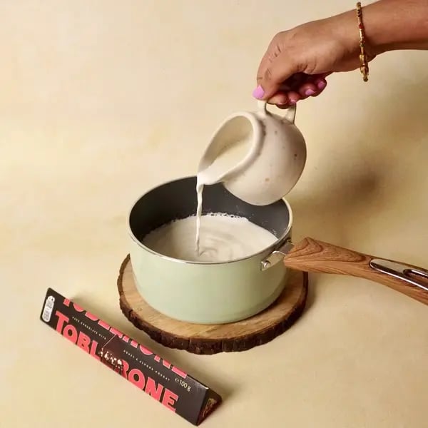 Toblerone Cocoa Hot Chocolate - Heating Milk Saucepan