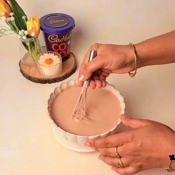 Traditional Bengali Mishti Doi Recipe With A Chocolatey Twist For Dussehra - Whisking Milk Mixture