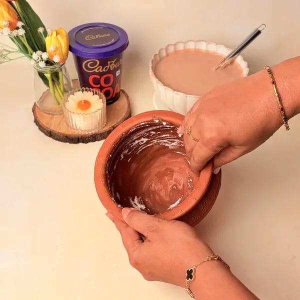Traditional Bengali Mishti Doi Recipe With A Chocolatey Twist For Dussehra - Coating Pot With Yogurt