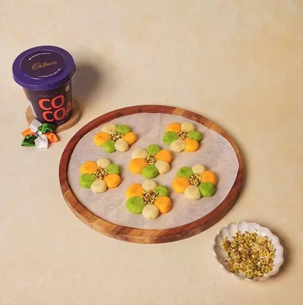 Tricolor Chocolate Flower Sondesh with Mawa and Pistachio for INDEPENDENCE DAY - Place a blue Gems candy at the center of each flower