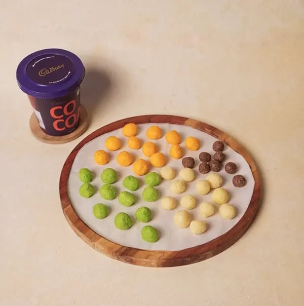 Tricolor Chocolate Flower Sondesh with Mawa and Pistachio for INDEPENDENCE DAY - Line a chopping board with parchment paper