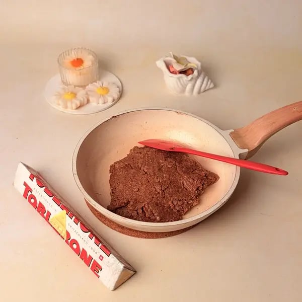 Try This Festive Special Chocolate Kesar Peda Recipe With A Toblerone Twist - Cooling Mixture On Plate