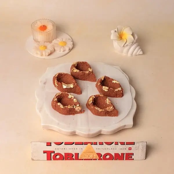 Try This Festive Special Chocolate Kesar Peda Recipe With A Toblerone Twist - Decorated Mawa Diyas