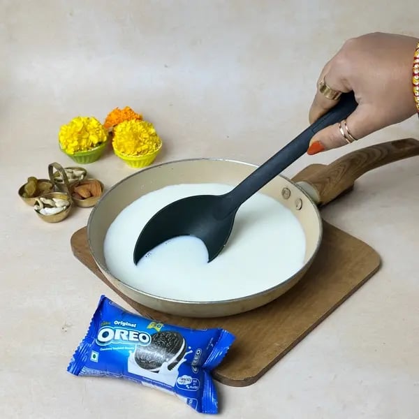Try This Oreo Cookies & Cream Fusion Basundi Recipe For Diwali - Simmering Milk In Pan