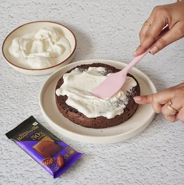 Vanilla ice cream Cake with Bournville Layers - Place one cake layer on a serving dish