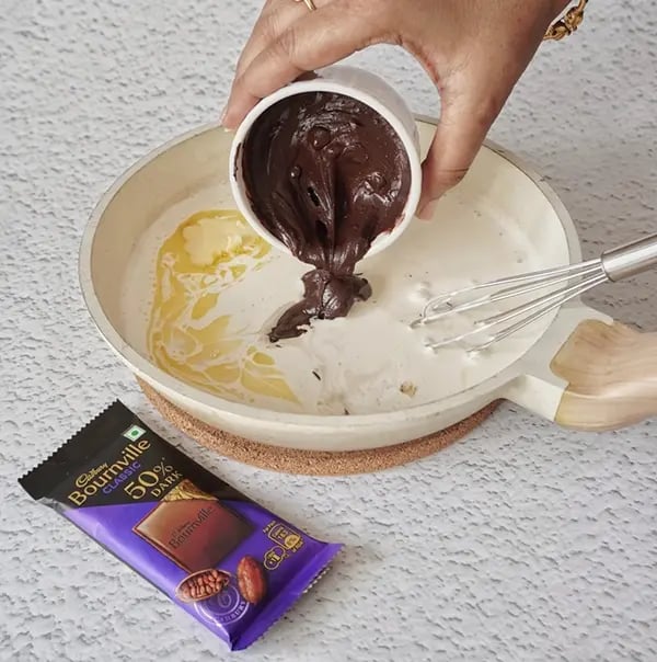 Vanilla ice cream Cake with Bournville Layers - Stir continuously