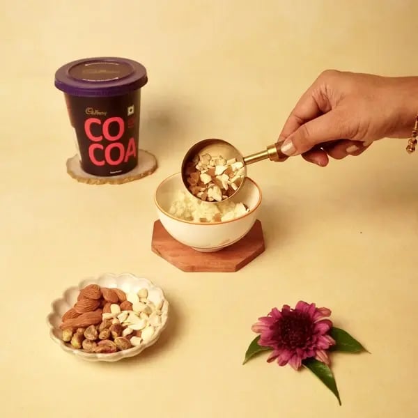 Vinayaka Chavithi Special Cocoa Paneer Modak - Mixing Nuts And Raisins