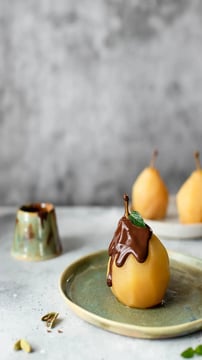 Elegant Chocolate-Poached Pears With Pistachio Crunch